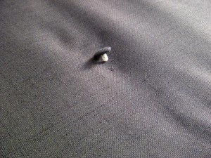 Fabric tufted button repair