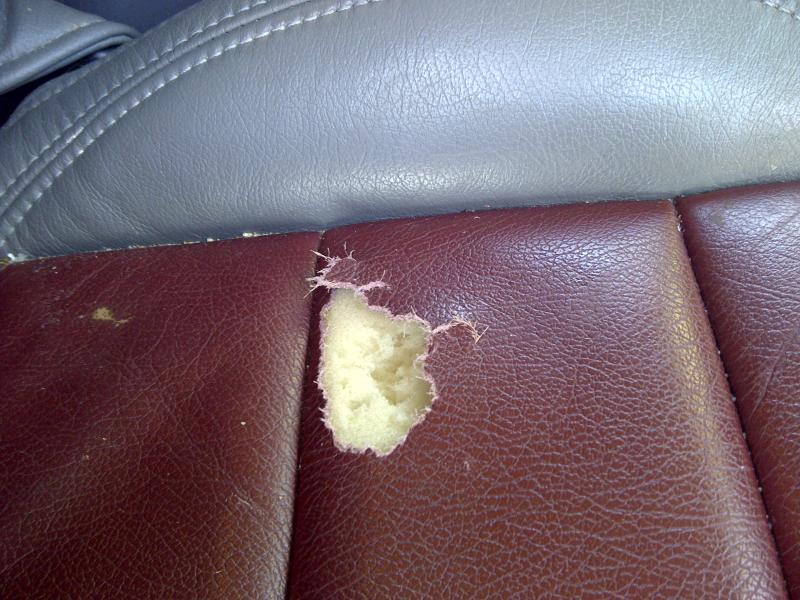 Leather car seat tear repair Leather car seat tear before