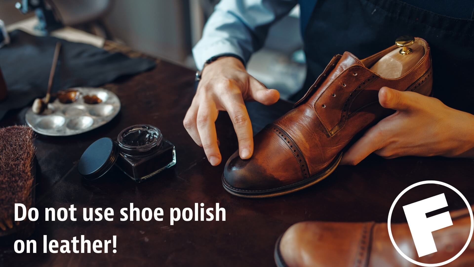 A man testing shoe polish on a weathered pair of leather shoes