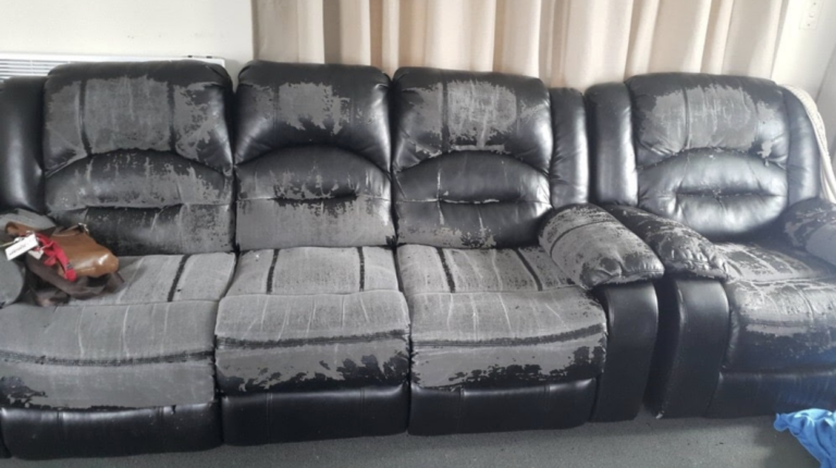 bonded leather couch with heavy peeling and fading